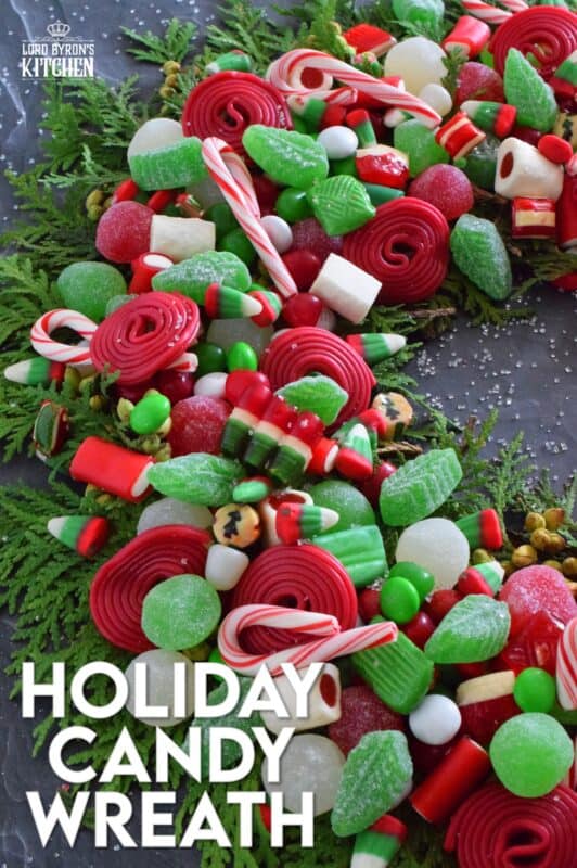 Prepare a Holiday Candy Wreath this Christmas and impress both the young and old kids in your home! Using as many red, green, and white candies as you can source, this bright and festive edible wreath is packed full of sweets! Set this up in the middle of your dessert buffet table, right on your kitchen island, or in the middle of your coffee table! Not only is it tasty, it also doubles as a decorative centerpiece! #wreath #candy #christmas #holiday #fingerfoods #party