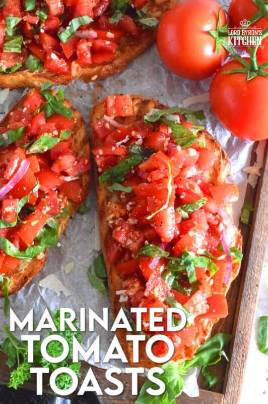 Summer fresh tomatoes are marinated with olive oil, garlic, red onions, and balsamic vinegar and piled high on garlic-rubbed grilled toast. Marinated Tomato Toasts are one of my favourite ways to use up my home-grown tomato harvest! #tomato #tomatoes #summerfresh #toasts #sourdough #bread #marinated