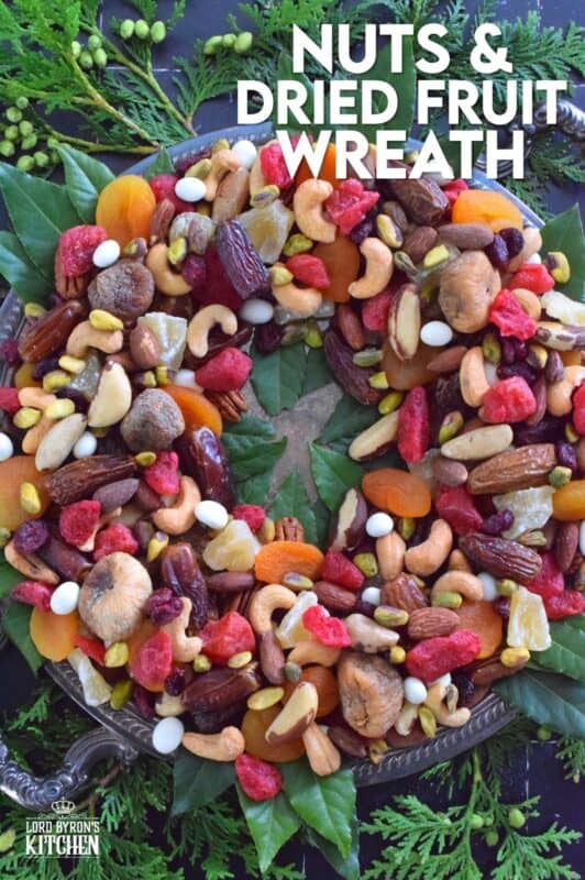 Christmastime is synonymous with nuts and fruits, so with that in mind, a Nuts and Dried Fruit Wreath was an obvious choice! No cooking or baking is necessary here! Assemble this beautiful, healthy snack wreath in very little time with a quick trip to your favourite bulk food supply store! #driedfruit #nuts #snacks #christmas #partyfoods #snackbowl