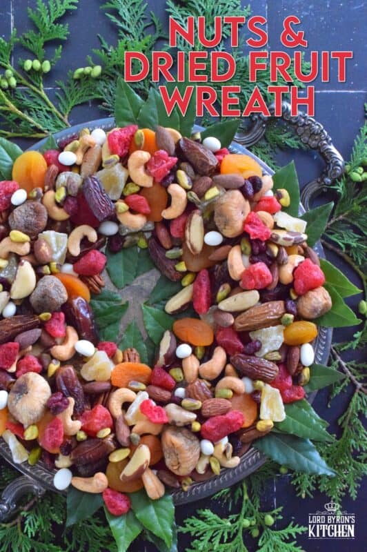 Christmastime is synonymous with nuts and fruits, so with that in mind, a Nuts and Dried Fruit Wreath was an obvious choice! No cooking or baking is necessary here! Assemble this beautiful, healthy snack wreath in very little time with a quick trip to your favourite bulk food supply store! #driedfruit #nuts #snacks #christmas #partyfoods #snackbowl