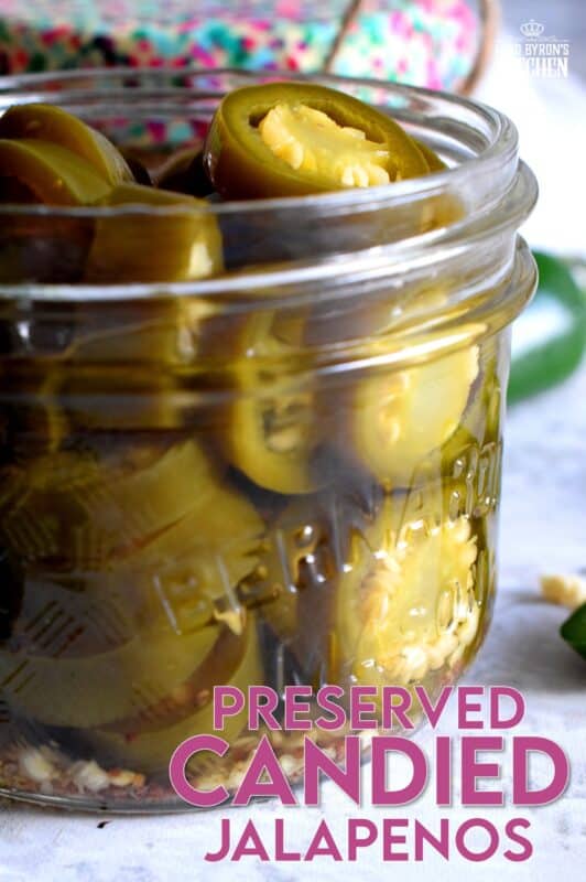 Preserved Candied Jalapenos are bite-sized morsels of heat and sweet - these are highly addictive, easy to prepare, and are a great addition to so many of your favourite recipes! This recipe makes four jars, but can easily be doubled or tripled if you feel like sharing! These make a great bring-along hostess gift too! #jalapenos #pickled #preserved #waterbath #canning