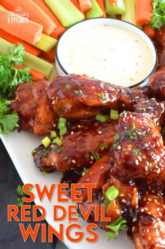 In this recipe, chicken wings are baked until golden brown and crispy and then they're tossed in a hot and spicy homemade sauce which is prepared in just a few minutes. Sweet Red Devil Wings are perfectly cooked and drenched in a thick, sticky sauce that I just can't get enough of! #sweetandsticky #wings #chicken #sauce