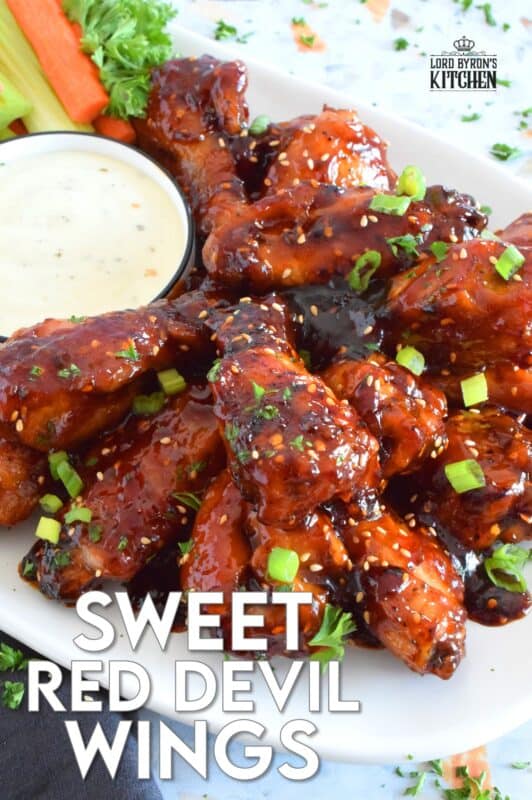 In this recipe, chicken wings are baked until golden brown and crispy and then they're tossed in a hot and spicy homemade sauce which is prepared in just a few minutes. Sweet Red Devil Wings are perfectly cooked and drenched in a thick, sticky sauce that I just can't get enough of! #sweetandsticky #wings #chicken #sauce