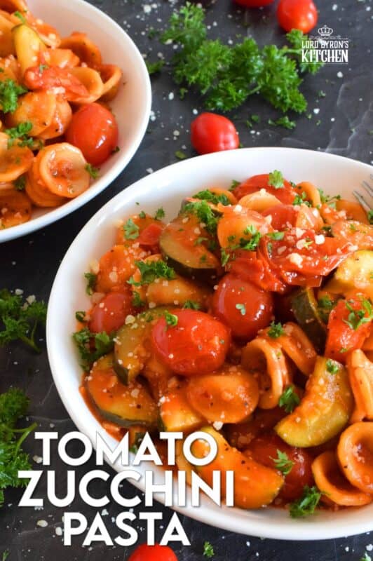 Two of the most common home-grown summer produce are tomatoes and zucchini. Harvest to your hearts' content and prepare copious amounts of this Tomato Zucchini Pasta. It's simple, it's healthy, and it's wonderfully delicious! Just one taste, and this will be a 30-minute recipe you will want to prepare repeatedly! #pasta #tomatoes #zucchini #meatlessmonday #vegetarian #summer #cherry #fresh #orecchiette #familyrecipes