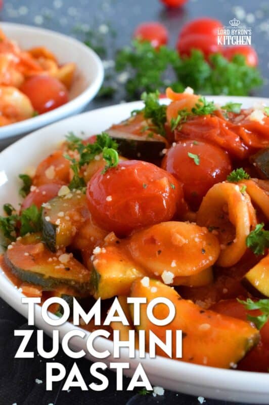 Two of the most common home-grown summer produce are tomatoes and zucchini. Harvest to your hearts' content and prepare copious amounts of this Tomato Zucchini Pasta. It's simple, it's healthy, and it's wonderfully delicious! Just one taste, and this will be a 30-minute recipe you will want to prepare repeatedly! #pasta #tomatoes #zucchini #meatlessmonday #vegetarian #summer #cherry #fresh #orecchiette #familyrecipes