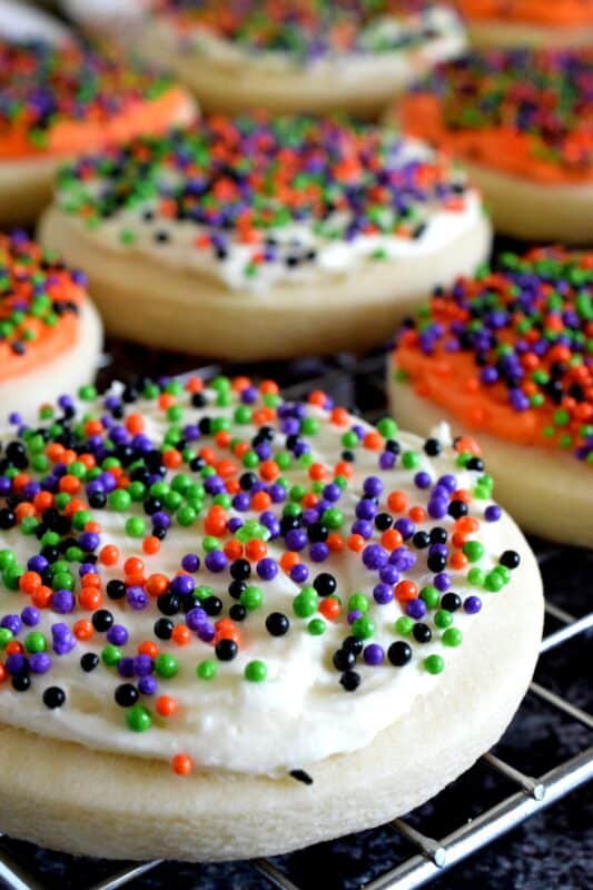 Copycat Lofthouse Halloween Sugar Cookies, a popular grocery store and bakery cookie confection in a homemade version, proving that homemade is always better! The next time you’re in line at the grocery store, look away from the store-bought ones, knowing full well that you can make them better yourself! #lofthouse #cookies #copycat #halloween #sugarcookies #sprinkles