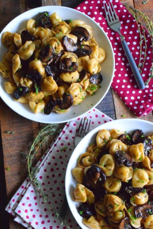 Loaded with fresh mushrooms and deep homey flavours that are synonymous with Thanksgiving, this vegetarian tortellini is the ultimate fall comfort food!  Who can resist mushrooms fried in butter?  That's only the start for this Thanksgiving Mushroom Tortellini! #vegetarian #pasta #tortellini #thanksgiving