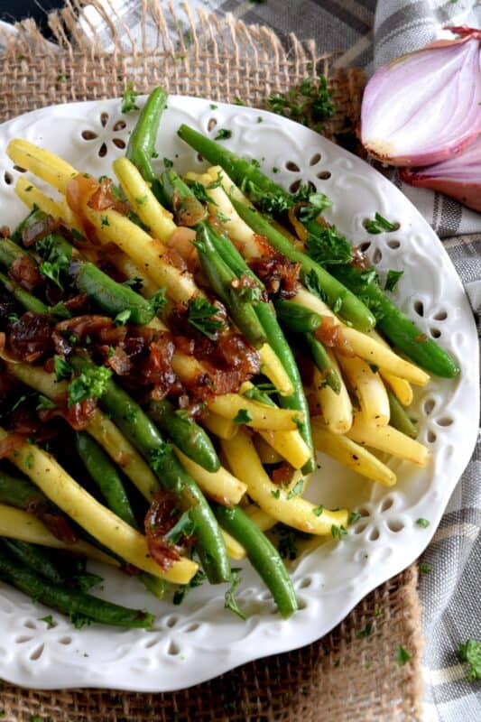 Beautifully and deliciously simple, Green Beans with Caramelized Shallots, is a fresh, light, and easy side dish alternative to the popular green bean casserole - no need for heavy creamed soup additives here! #greenbeans #sidedish #vegetables #thanksgiving #vegetarian