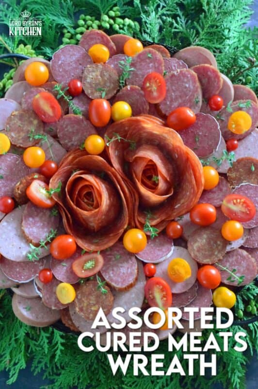 Every festive gathering needs to have a platter of deli-style meats to accompany the crackers, bread, pickles, and cheeses. This impressive Assorted Cured Meats Wreath is just what you need for your holiday buffet table. Prepared with pepperoni, salami, kielbasa, and more, this wreath is for all of the carnivores in your life! #wreath #christmas #holiday #charcuterie