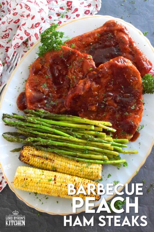 The combination of a sweet and smoky barbecue sauce with jarred peach preserves is the perfect addition to accompany these oven-baked ham steaks. Add some garlic, onion, and a little ground black pepper to round out the flavours and you've got a very delicious family-style recipe for tonight's dinner! #ham #hamsteak #peach #bbq #bakedham