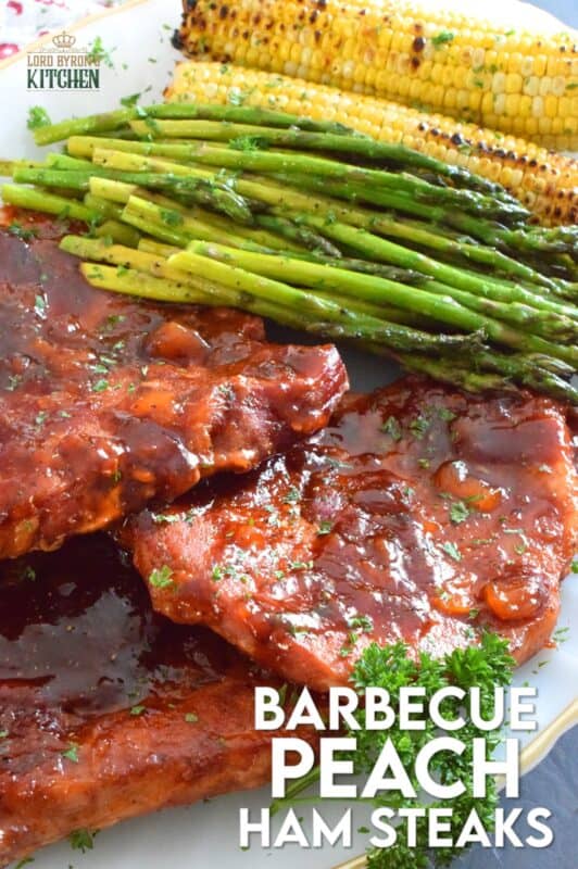 The combination of a sweet and smoky barbecue sauce with jarred peach preserves is the perfect addition to accompany these oven-baked ham steaks. Add some garlic, onion, and a little ground black pepper to round out the flavours and you've got a very delicious family-style recipe for tonight's dinner! #ham #hamsteak #peach #bbq #bakedham