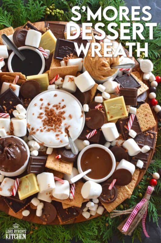 The ultimate rich and indulgent treat can be summed up in three words - S'mores Dessert Wreath! Assemble all of the ingredients into a large wreath and set it out for your guests. Utilizing marshmallow fluff will mimic the gooey marshmallow effect everyone craves, but you can make s'mores more authentic by roasting the marshmallows using your fireplace or even a candle! #smores #christmas #holiday #dessertbar