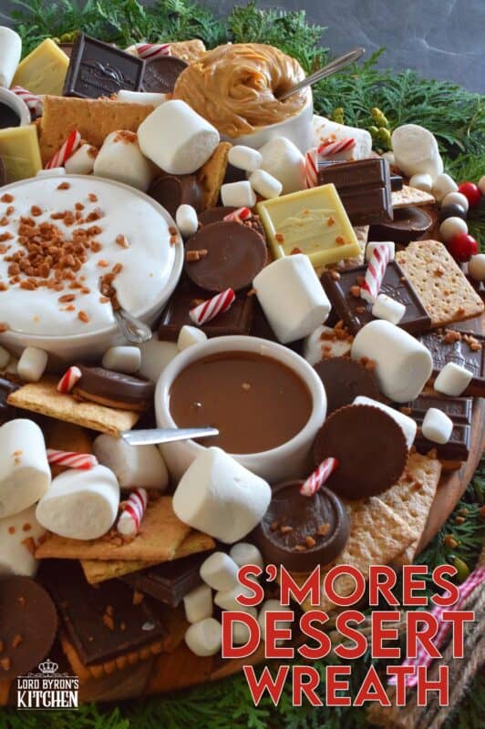 The ultimate rich and indulgent treat can be summed up in three words - S'mores Dessert Wreath! Assemble all of the ingredients into a large wreath and set it out for your guests. Utilizing marshmallow fluff will mimic the gooey marshmallow effect everyone craves, but you can make s'mores more authentic by roasting the marshmallows using your fireplace or even a candle! #smores #christmas #holiday #dessertbar