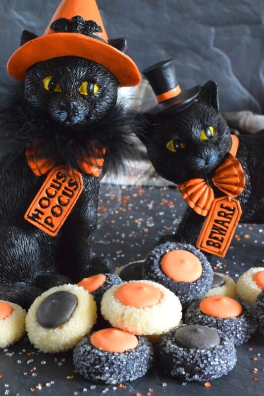 Similar to a classic thumbprint cookie, these Halloween Candy Melt Cookies use candy melts instead of jam. The cookie dough is tinted with food colouring and rolled in sanding sugar, these are all treat and no trick! #halloween #trickortreat #halloweencookies #candymelts #thumbprint