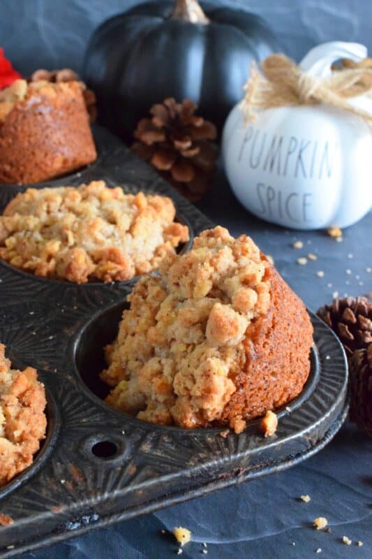 This muffin is the perfect fall treat! Pumpkin Streusel Muffins are chock full of pumpkin spice flavour and topped with a crunchy streusel topping made with chopped pecans. This muffin has just the right amount of sweetness, and it's deliciously soft and moist! It's hard to eat just one of these! #pumpkin #streusel #muffins #pumpkinspice #pecans