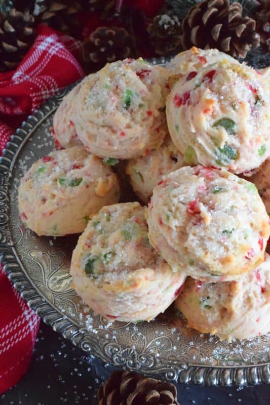 These light and fluffy Almond Cherry Snowballs are packed with both red and green candied cherries, which in our home, is the epitome of holiday baking. Prepared with the most basic of pantry ingredients, these cookies are nothing short of extraordinary, and they taste like an old fashioned Christmas at home! #snowballs #cookies #candied #cherries #almond #christmas #baking