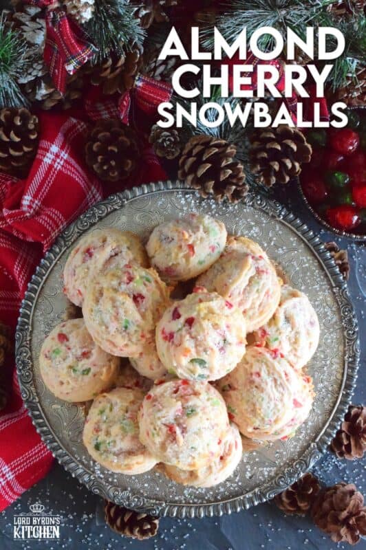 These light and fluffy Almond Cherry Snowballs are packed with both red and green candied cherries, which in our home, is the epitome of holiday baking. Prepared with the most basic of pantry ingredients, these cookies are nothing short of extraordinary, and they taste like an old fashioned Christmas at home! #snowballs #cookies #candied #cherries #almond #christmas #baking