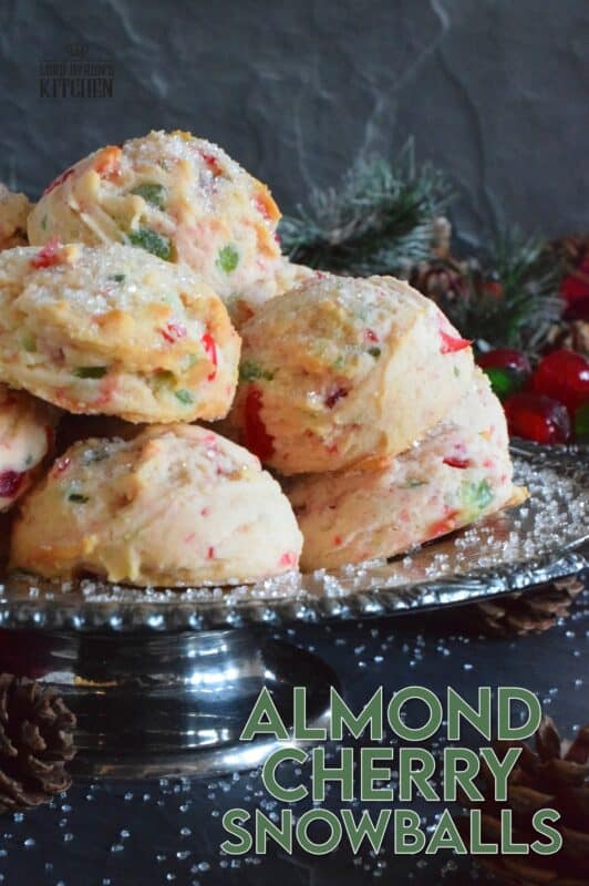These light and fluffy Almond Cherry Snowballs are packed with both red and green candied cherries, which in our home, is the epitome of holiday baking. Prepared with the most basic of pantry ingredients, these cookies are nothing short of extraordinary, and they taste like an old fashioned Christmas at home! #snowballs #cookies #candied #cherries #almond #christmas #baking