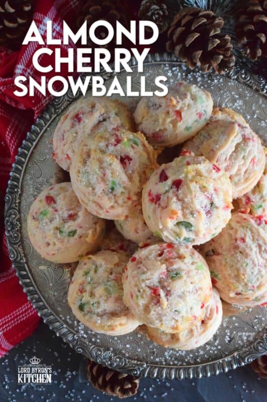 These light and fluffy Almond Cherry Snowballs are packed with both red and green candied cherries, which in our home, is the epitome of holiday baking. Prepared with the most basic of pantry ingredients, these cookies are nothing short of extraordinary, and they taste like an old fashioned Christmas at home! #snowballs #cookies #candied #cherries #almond #christmas #baking