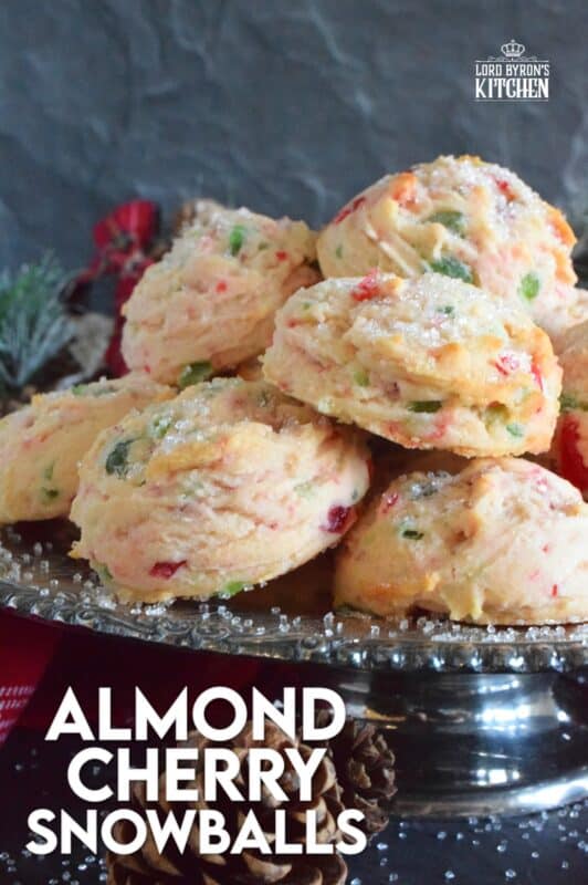 These light and fluffy Almond Cherry Snowballs are packed with both red and green candied cherries, which in our home, is the epitome of holiday baking. Prepared with the most basic of pantry ingredients, these cookies are nothing short of extraordinary, and they taste like an old fashioned Christmas at home! #snowballs #cookies #candied #cherries #almond #christmas #baking