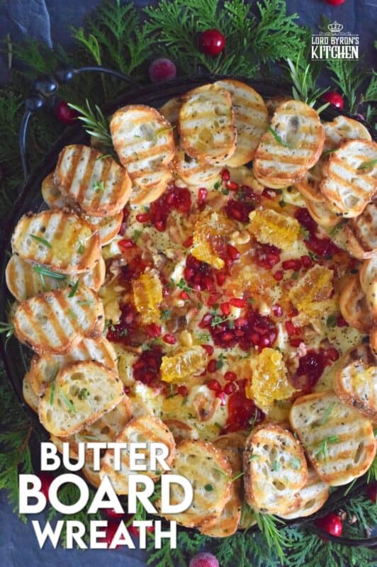 Just like charcuterie boards have become super popular, butter boards are about to become the next trending appetizer.  Serve grilled bread or crackers with a Butter Board Wreath to your guests this holiday season. With a Christmas-inspired flavour profile, everyone is going to love this fun and festive treat! #butter #board #butterboard #wreath #appetizer #christmas