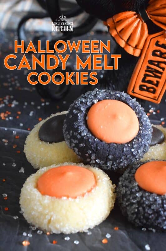 Similar to a classic thumbprint cookie, these Halloween Candy Melt Cookies use candy melts instead of jam. The cookie dough is tinted with food colouring and rolled in sanding sugar, these are all treat and no trick! #halloween #trickortreat #halloweencookies #candymelts #thumbprint