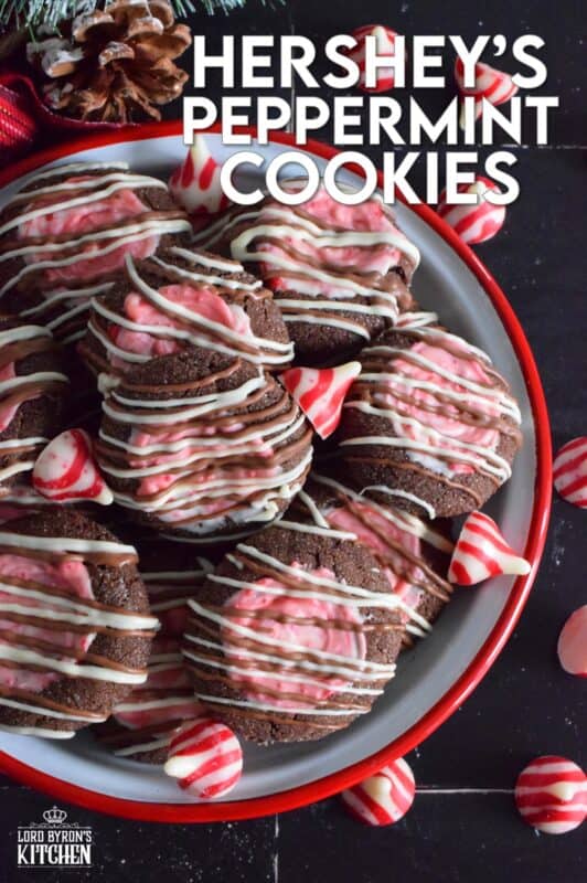 These soft chocolaty Hershey's Peppermint Cookies are baked and then topped with a peppermint kiss as soon as they come out of the oven. Once softened, the kiss is swirled to cover the top of the cookie and then drizzled with melted white chocolate. #peppermint #hershey #kisses #cookies #christmas