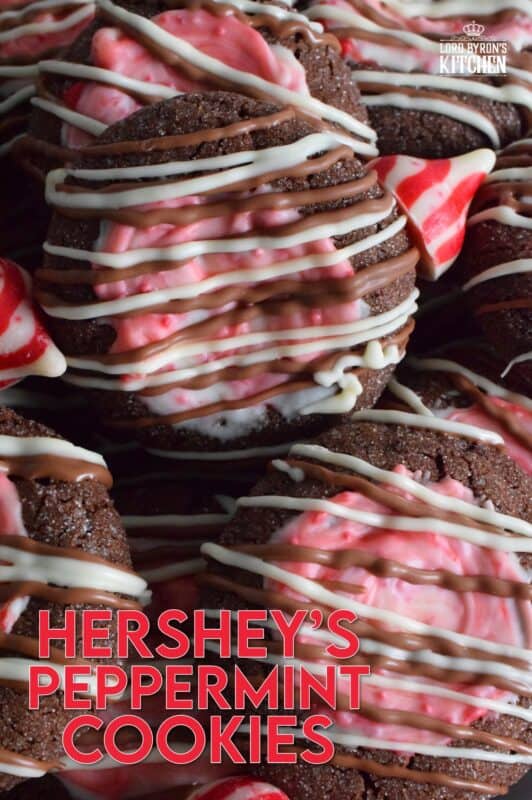 These soft chocolaty Hershey's Peppermint Cookies are baked and then topped with a peppermint kiss as soon as they come out of the oven. Once softened, the kiss is swirled to cover the top of the cookie and then drizzled with melted white chocolate. #peppermint #hershey #kisses #cookies #christmas