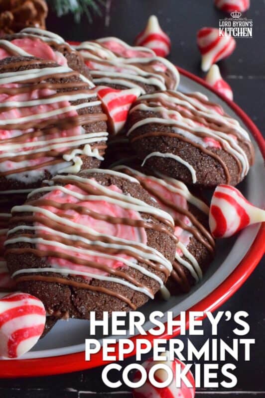 These soft chocolaty Hershey's Peppermint Cookies are baked and then topped with a peppermint kiss as soon as they come out of the oven. Once softened, the kiss is swirled to cover the top of the cookie and then drizzled with melted white chocolate. #peppermint #hershey #kisses #cookies #christmas
