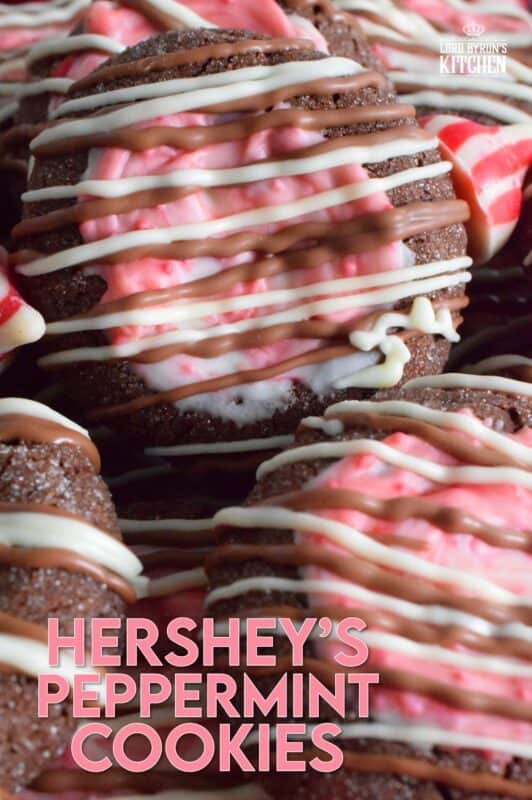 These soft chocolaty Hershey's Peppermint Cookies are baked and then topped with a peppermint kiss as soon as they come out of the oven. Once softened, the kiss is swirled to cover the top of the cookie and then drizzled with melted white chocolate. #peppermint #hershey #kisses #cookies #christmas