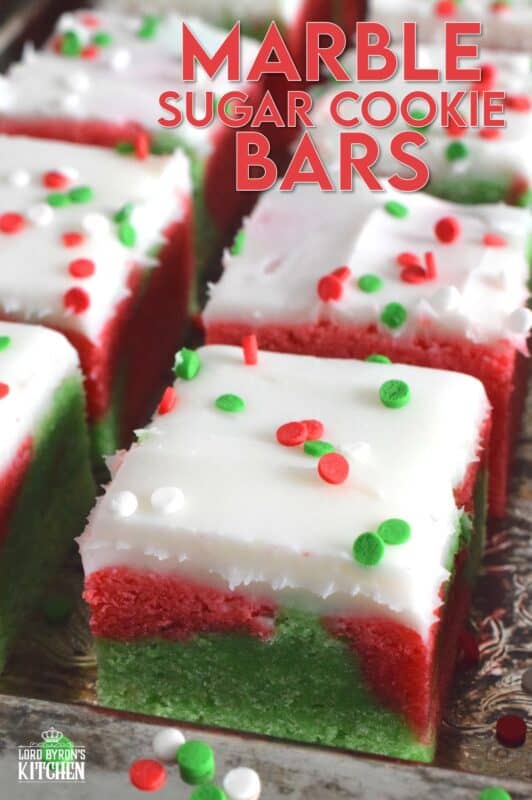 These pillow-soft, beautifully festive red and green Marble Sugar Cookie Bars are going to be on everyone's wishlist this Christmas! The cookie base is buttery and sweet with a light fruity note and topped with a homemade buttercream frosting. One should not question if they will make these; only question whether you will call them bars, squares, cookies, or even cake! #sugarcookies #bars #squares #christmas #holiday #baking #marble #redandgreen