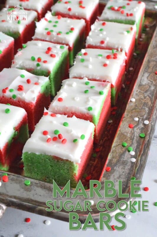 These pillow-soft, beautifully festive red and green Marble Sugar Cookie Bars are going to be on everyone's wishlist this Christmas! The cookie base is buttery and sweet with a light fruity note and topped with a homemade buttercream frosting. One should not question if they will make these; only question whether you will call them bars, squares, cookies, or even cake! #sugarcookies #bars #squares #christmas #holiday #baking #marble #redandgreen