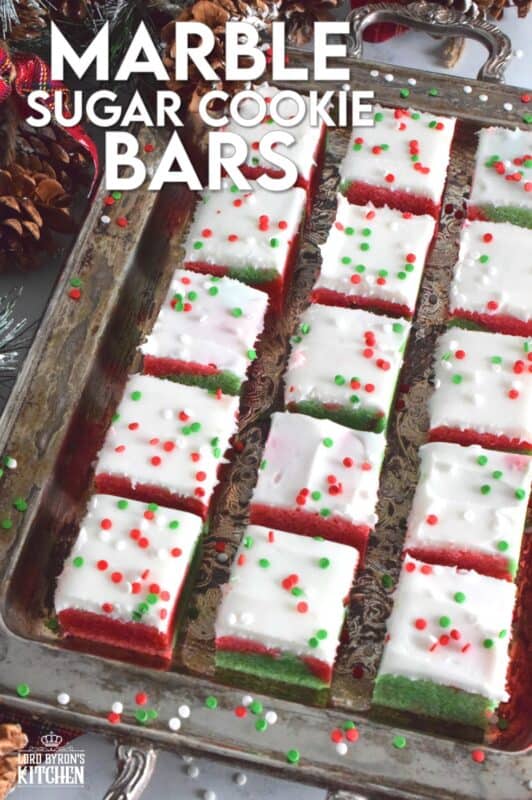 These pillow-soft, beautifully festive red and green Marble Sugar Cookie Bars are going to be on everyone's wishlist this Christmas! The cookie base is buttery and sweet with a light fruity note and topped with a homemade buttercream frosting. One should not question if they will make these; only question whether you will call them bars, squares, cookies, or even cake! #sugarcookies #bars #squares #christmas #holiday #baking #marble #redandgreen