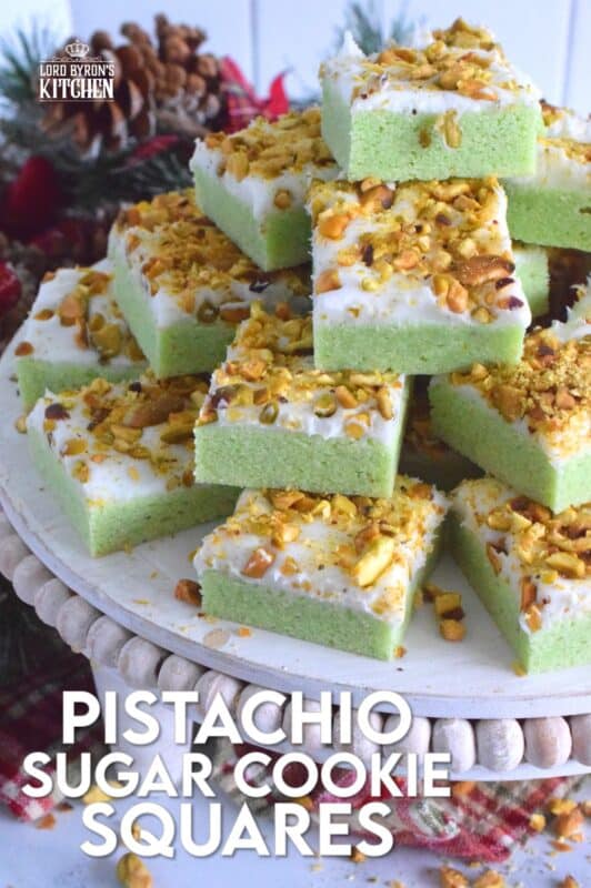 The uncomplicated and delicious sugar cookie gets a fresh, new flavour profile, and an upgrade in this Pistachio Sugar Cookie Squares recipe.  The classic sugar cookie base is pistachio flavoured and prepared with boxed pistachio pudding powder.  Topped with a layer of delicious buttercream frosting and sprinkled with roasted, salted chopped pistachios, this cookie is simply irresistible! #pistachio #sugarcookies #cookies #christmas #holiday #squares #baking
