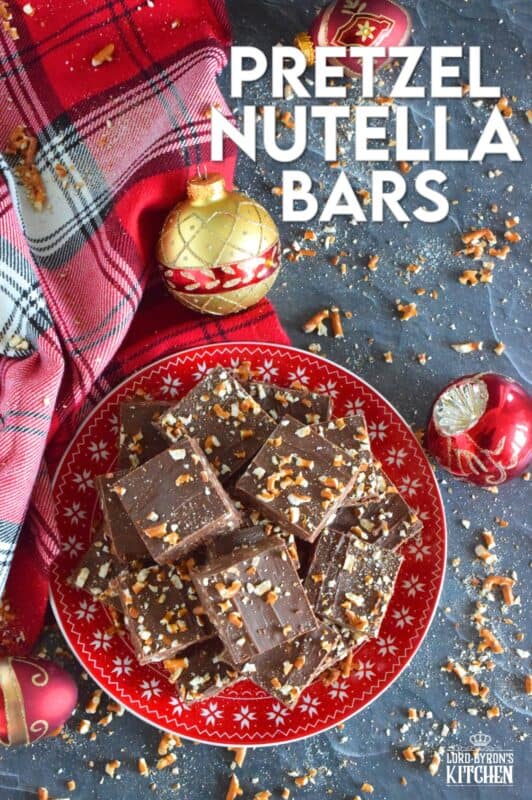 Nutella is very popular in most families, especially families with kids. Pretzel Nutella Bars combines the nutty and creamy chocolatey-ness that is Nutella with the crunchiness and saltiness of pretzels. And, if that wasn't enough, the bars are topped with melted Mirage Candy Bars! #nutella #candybar #chocolate #bars #nobake