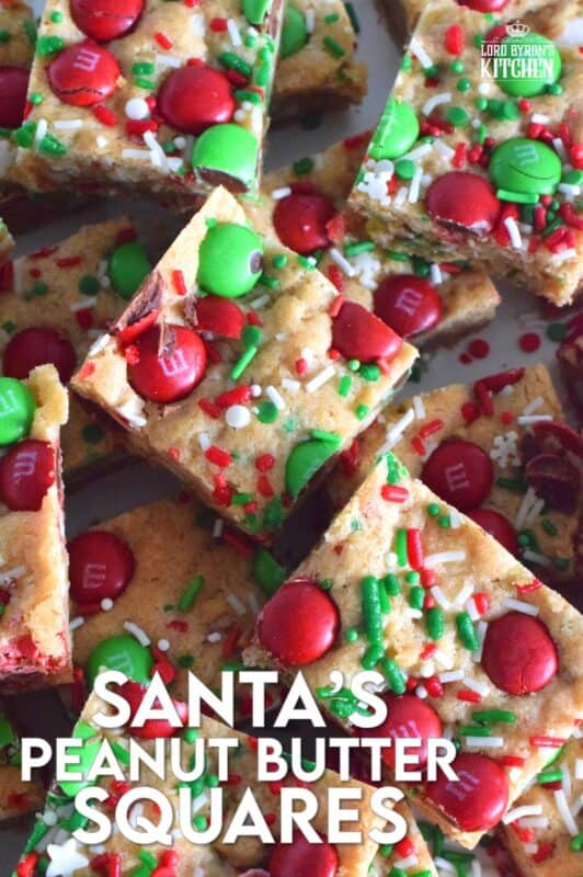 If you want extra presents under the tree this year, leave a couple of these Santa's Peanut Butter Squares with a tall glass of milk on the mantle this Christmas Eve! Loaded with sprinkles, M&Ms, white chocolate chips, peanut butter, and more, who wouldn't want to sink their teeth into this festive treat!? #holidaybars #m&ms #cookies #christmas #baking