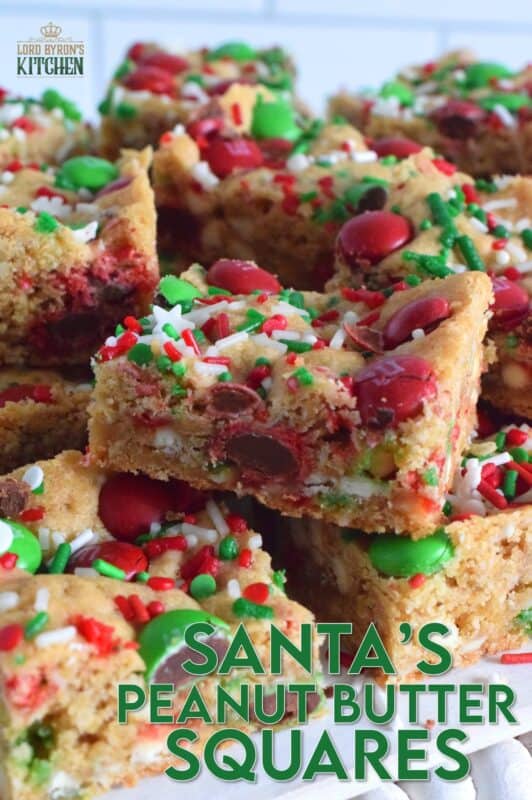 If you want extra presents under the tree this year, leave a couple of these Santa's Peanut Butter Squares with a tall glass of milk on the mantle this Christmas Eve! Loaded with sprinkles, M&Ms, white chocolate chips, peanut butter, and more, who wouldn't want to sink their teeth into this festive treat!? #holidaybars #m&ms #cookies #christmas #baking