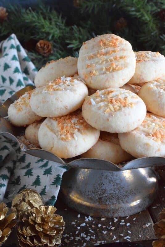 Christmas isn't Christmas without shortbread, and while everyone seems to have a favourite shortbread recipe or two, there's always room for one more! Toasted Coconut Whipped Shortbread pairs an easy whipped shortbread cookie recipe with the wonderful taste of golden, toasted coconut, making this a must-bake cookie this holiday season! #coconut #shortbread #toasted #cookies
