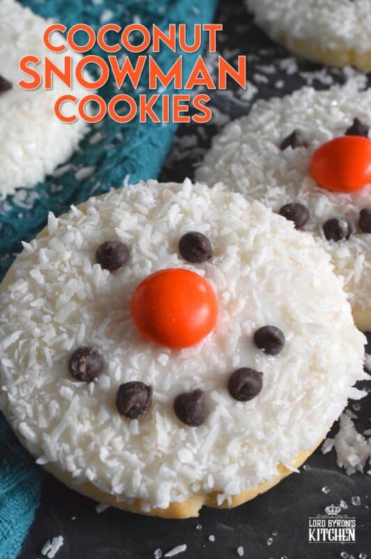 Coconut Snowman Cookies are simply adorable! They're also very easy to make, inexpensive, and delicious too! The base of the cookie melts in your mouth! Using mini chocolate chips for his eyes and mouth, and an orange candy-coated chocolate for his nose, these cookies are almost too cute to eat! #snowman #coconut #cookies #sugarcookies