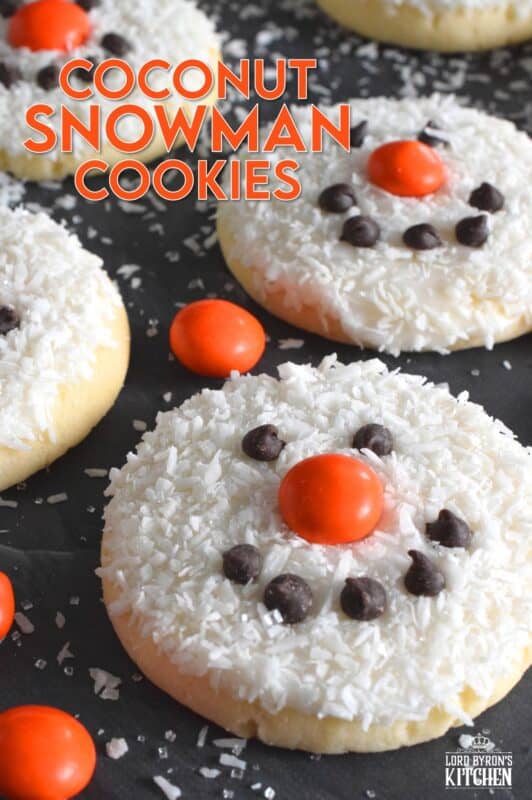 Coconut Snowman Cookies are simply adorable! They're also very easy to make, inexpensive, and delicious too! The base of the cookie melts in your mouth! Using mini chocolate chips for his eyes and mouth, and an orange candy-coated chocolate for his nose, these cookies are almost too cute to eat! #snowman #coconut #cookies #sugarcookies