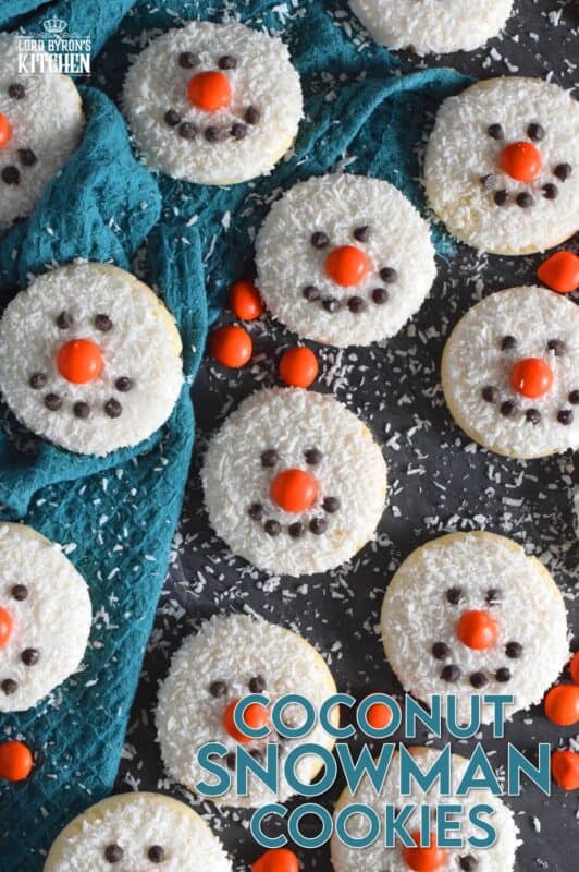Coconut Snowman Cookies are simply adorable! They're also very easy to make, inexpensive, and delicious too! The base of the cookie melts in your mouth! Using mini chocolate chips for his eyes and mouth, and an orange candy-coated chocolate for his nose, these cookies are almost too cute to eat! #snowman #coconut #cookies #sugarcookies