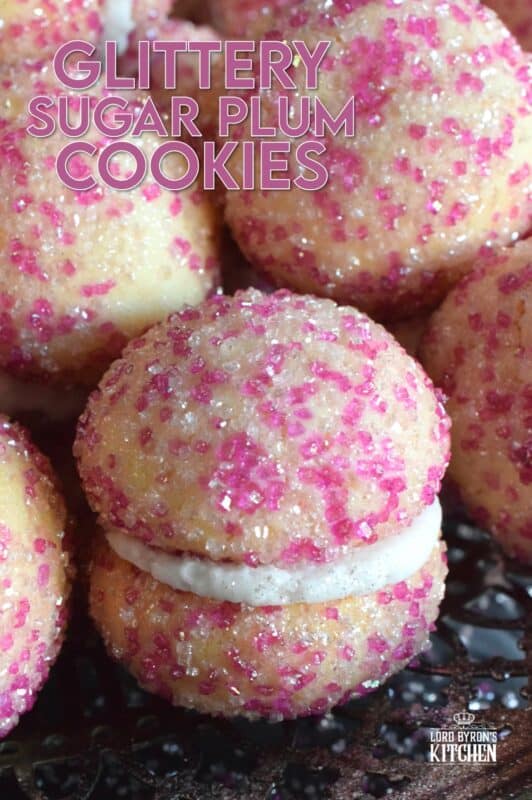These beautiful, shimmering, Glittery Sugar Plum Cookies are the epitome of priceless luxury on a dollar store budget.The cookies are baked with a sparkling, sugary coating and sandwiched together with an easy, sweet frosting. One bite and you'll certainly have visions of these sugar plums dancing in your head on Christmas Eve night! #sugarplums #christmas #baking #cookies #glitter