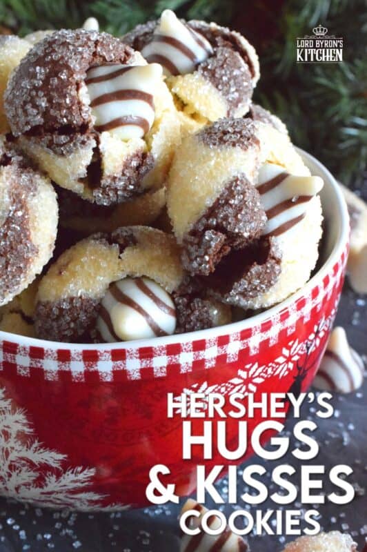 A deliciously decadent half vanilla and half chocolate cookie, coated in sugar, and topped with a chocolate kiss, Hershey’s Hugs and Kiss Cookies are a perfect holiday treat that everyone will love! These are quick and easy - no need to chill the cookie dough before baking either! Don't they look absolutely adorable!? #hershey #hugsandkisses #christmas #cookies