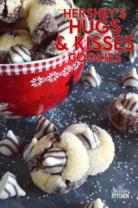 A deliciously decadent half vanilla and half chocolate cookie, coated in sugar, and topped with a chocolate kiss, Hershey’s Hugs and Kiss Cookies are a perfect holiday treat that everyone will love! These are quick and easy - no need to chill the cookie dough before baking either! Don't they look absolutely adorable!? #hershey #hugsandkisses #christmas #cookies