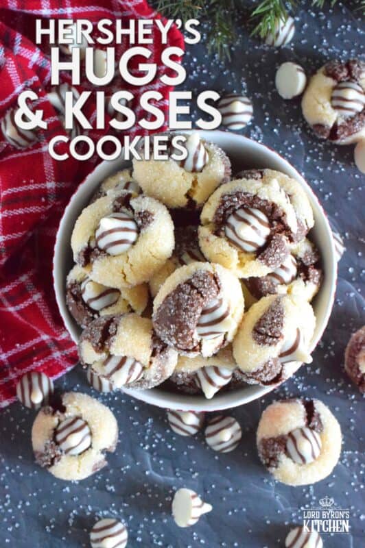 A deliciously decadent half vanilla and half chocolate cookie, coated in sugar, and topped with a chocolate kiss, Hershey’s Hugs and Kiss Cookies are a perfect holiday treat that everyone will love! These are quick and easy - no need to chill the cookie dough before baking either! Don't they look absolutely adorable!? #hershey #hugsandkisses #christmas #cookies