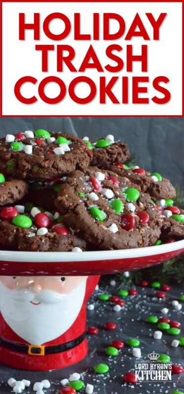 Holiday Trash Cookies are loaded with both milk and white chocolate chips, M&Ms, crushed pretzels, and marshmallow bits too! The cookie dough is prepared with brown sugar, which means these cookies are soft and moist on the inside, but they have a crisp exterior! Make a delightfully tasty gift by packaging these festive cookies up in boxes and tying them with a bright festive ribbon! #mandm #christmas #santa #cookies #trash