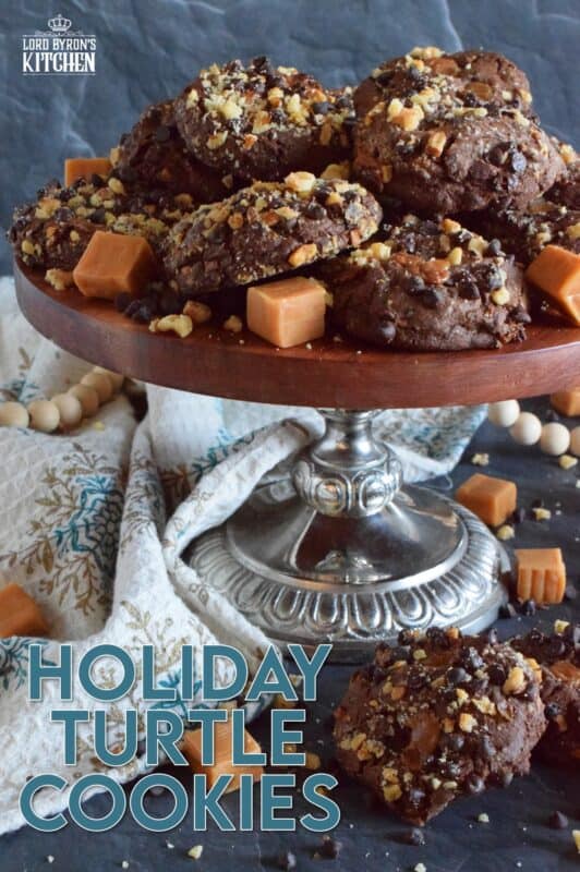 Turtles, turtles, rah, rah, rah! If you remember that jingle and you ate the popular chocolate confection that was popularized by it, then you might enjoy these Holiday Turtle Cookies too! Baked inside and outside of the most delicious chocolate cookie dough are toasted pecans, chocolate chips, and lots of sticky, gooey caramel.  You're going to love this one! #turtles #chocolate #cookies #caramel #pecans