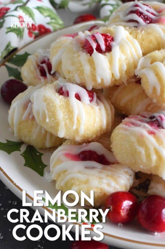 These mini, bite-sized Lemon Cranberry Cookies are prepared with a lightly sweetened vanilla cookie dough and topped with a sugary, sweet glaze. Don't worry - the tartness of both the lemon and the cranberry can easily stand up to the sweetness! #lemoncranberry #cranberry #cranberries #cookies