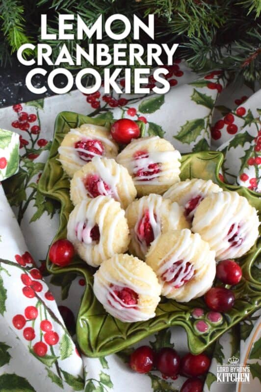 These mini, bite-sized Lemon Cranberry Cookies are prepared with a lightly sweetened vanilla cookie dough and topped with a sugary, sweet glaze. Don't worry - the tartness of both the lemon and the cranberry can easily stand up to the sweetness! #lemoncranberry #cranberry #cranberries #cookies