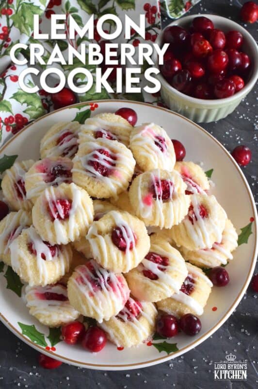 These mini, bite-sized Lemon Cranberry Cookies are prepared with a lightly sweetened vanilla cookie dough and topped with a sugary, sweet glaze. Don't worry - the tartness of both the lemon and the cranberry can easily stand up to the sweetness! #lemoncranberry #cranberry #cranberries #cookies